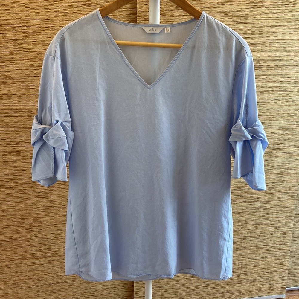 Blouse with ribbon sleeve design